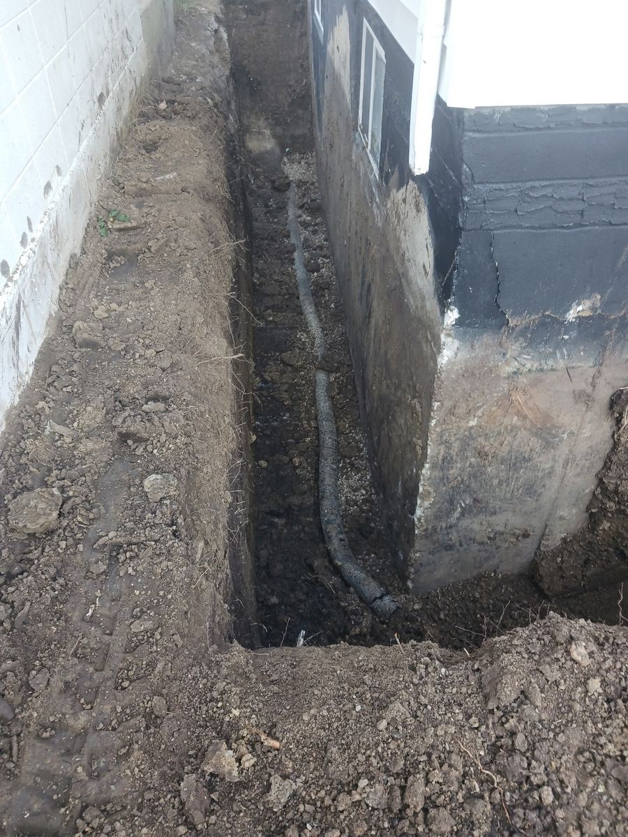 Trench run along foundation for drain tile
